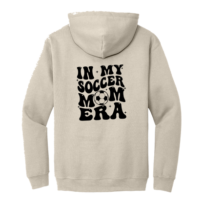 In My Soccer Mom Era Front & Back design on a Sand adult hoodie, back view.