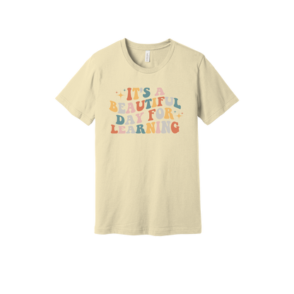 It's a Beautiful Day for Learning design on a Natural adult T-shirt, front view.