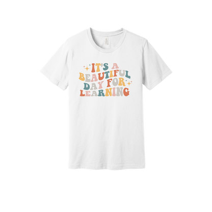 It's a Beautiful Day for Learning design on a White adult T-shirt, front view.
