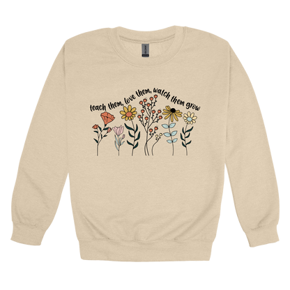 Teach Them, Love Them, Let Them Grow design on a Sand adult crewneck sweatshirt, front view.