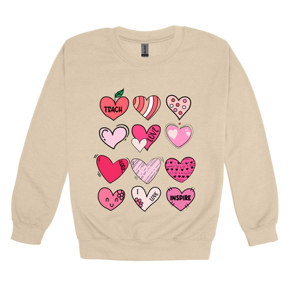 Teach Love Inspire Hearts teacher design on Sand adult Crewneck, front view.