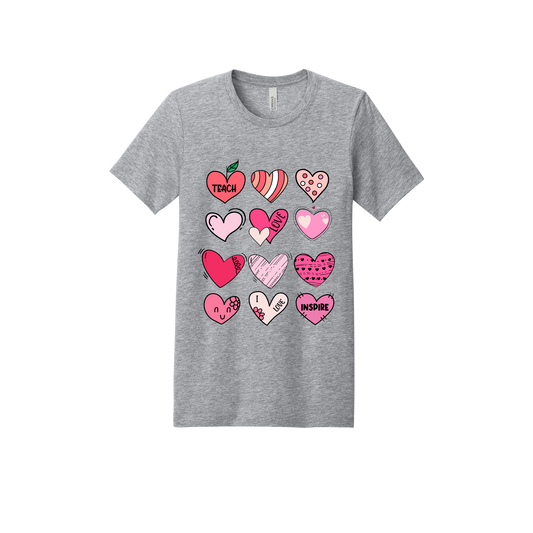 Teach Love Inspire Hearts teacher design on Heather Athletic Gray adult T-Shirt, front view.