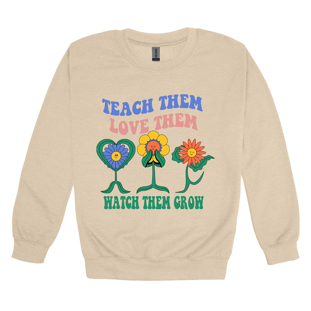 Teach Them Love Them teacher design on Sand adult Crewneck, front view.