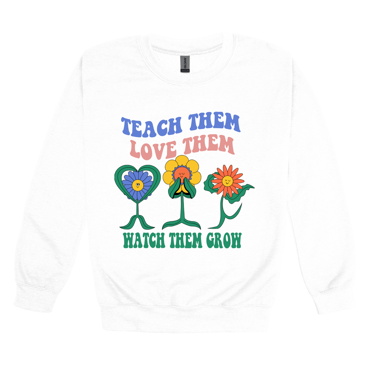 Teach Them Love Them teacher design on White adult Crewneck, front view.