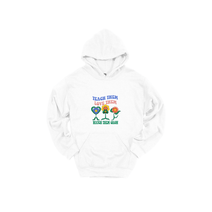 Teach Them Love Them teacher design on White adult Hoodie, front view.