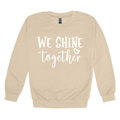 We Shine Together design on Sand adult Crewneck, front view.