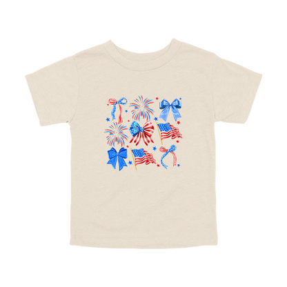 Fourth of July Bow Apparel design on toddler tee in tan, front view.