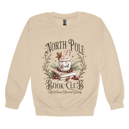 North Pole Book Club Apparel design on adult crewneck in tan, front view.