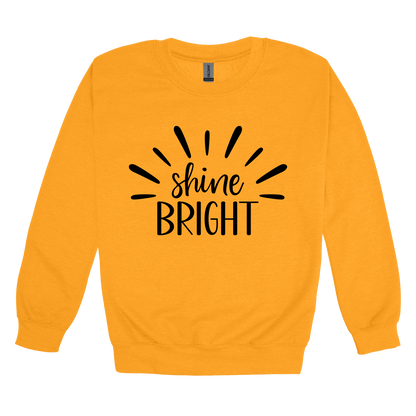 Shine Bright Apparel design on adult crewneck in yellow gold, front view.