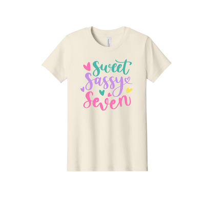 Sweet, Sassy & 7 Apparel design on official Youth Bella+Canvas T-shirt in Natural, front view.