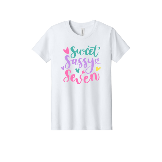 Sweet, Sassy & 7 Apparel design on official Youth Bella+Canvas T-shirt in White, front view.