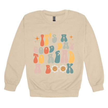 It's a Good Day to Read a Book Apparel design on adult crewneck in tan, front view.
