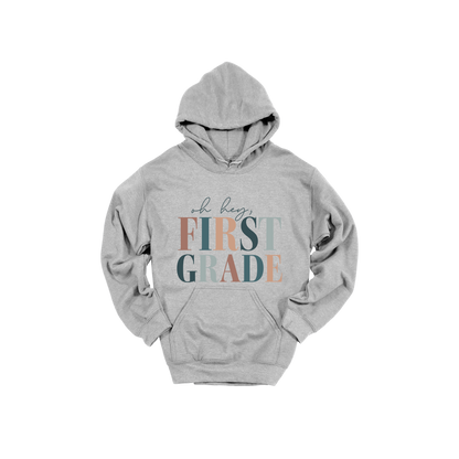 Oh Hey First Grade design shown on Sport Gray adult Gildan hoodie.