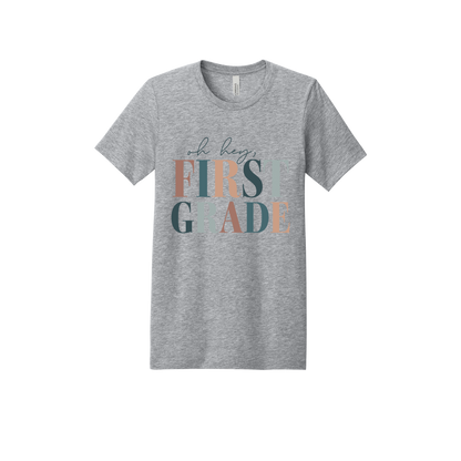 Oh Hey First Grade design shown on Heather Athletic Gray adult Bella+Canvas 3001 T-shirt.