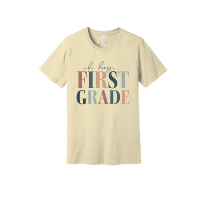 Oh Hey First Grade design shown on Natural adult Bella+Canvas 3001 T-shirt.