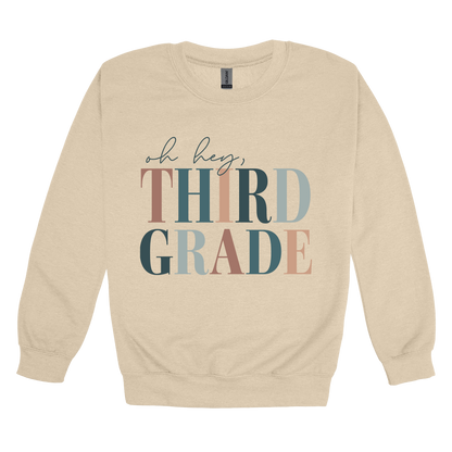 Oh Hey Third Grade design shown on Sand adult Gildan crewneck sweatshirt.