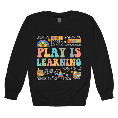 Play Is Learning design shown on Black adult Gildan crewneck sweatshirt.
