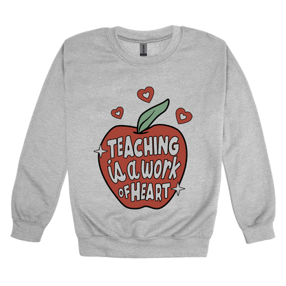 Teaching Is a Work of Heart design shown on Sport Gray adult Gildan crewneck sweatshirt.
